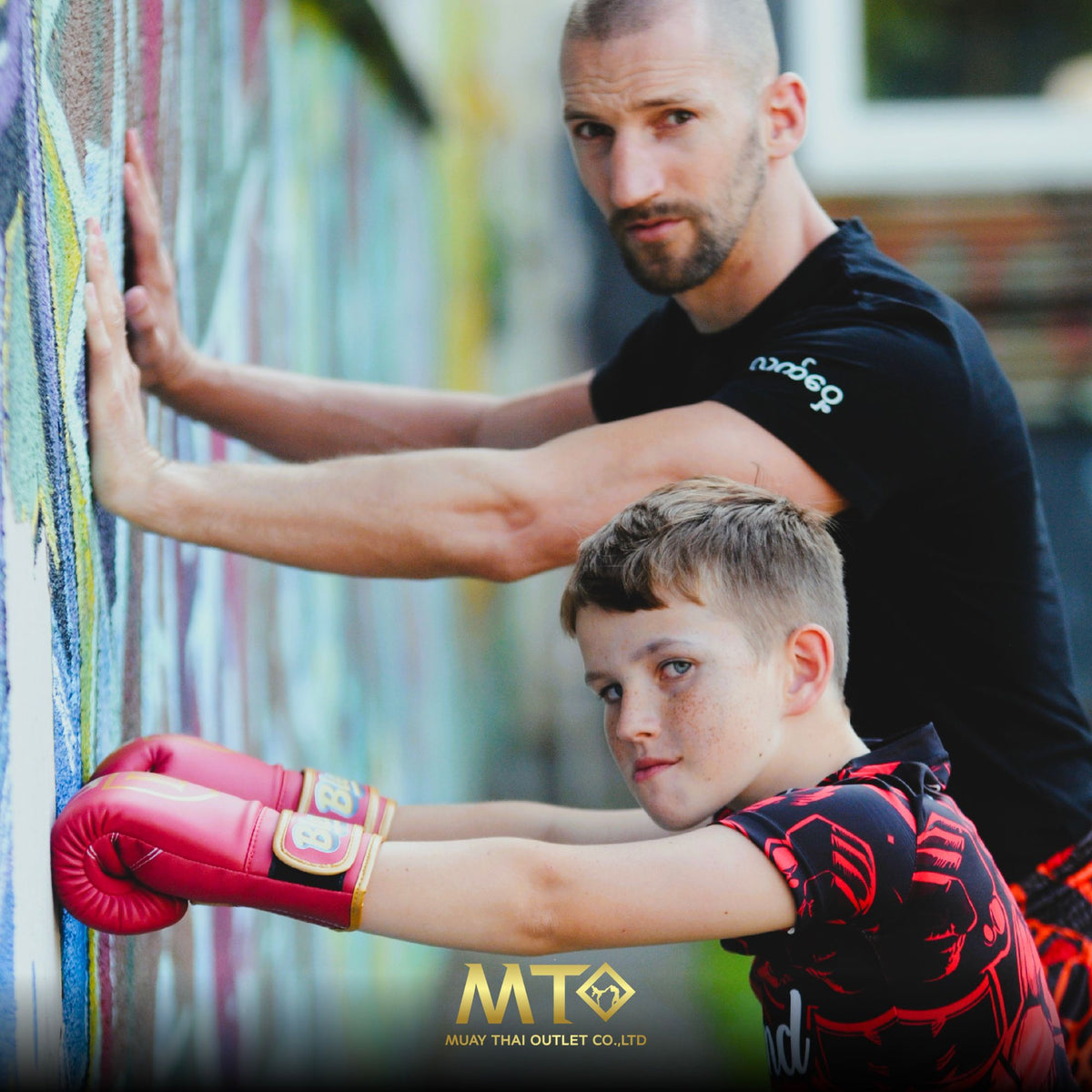Trainer and kid warming up in Blegend gear